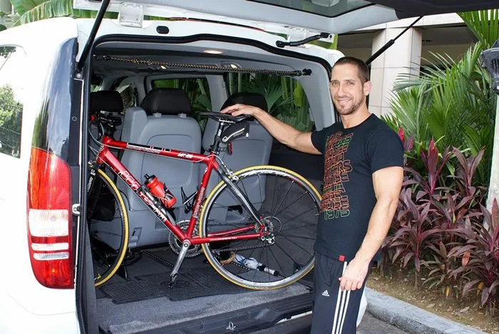 A bicycle loaded into an SGCAB maxicab